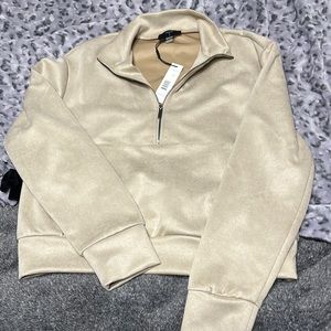 A tan half zip up hoodie from TAHARI, size xs